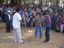 Trainees performing a play at the market of village Damal 